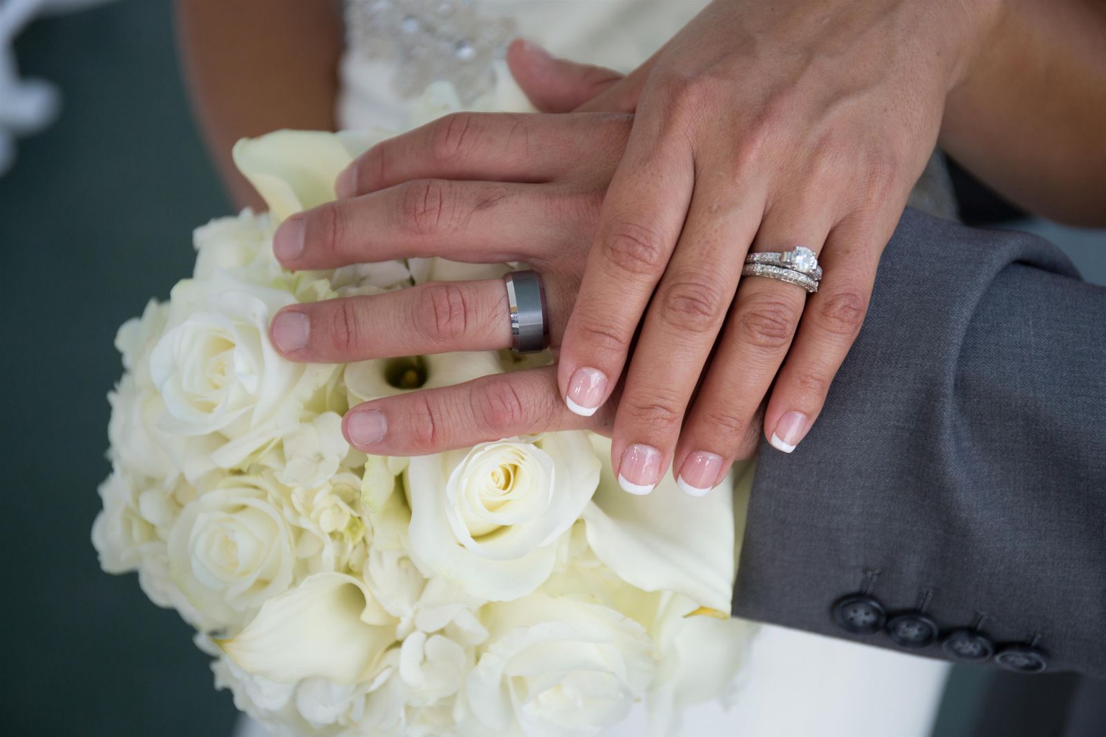 bride and groom with wedding rings