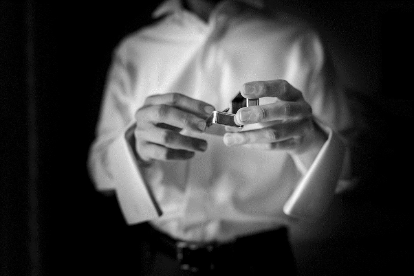 man holding wedding ring box