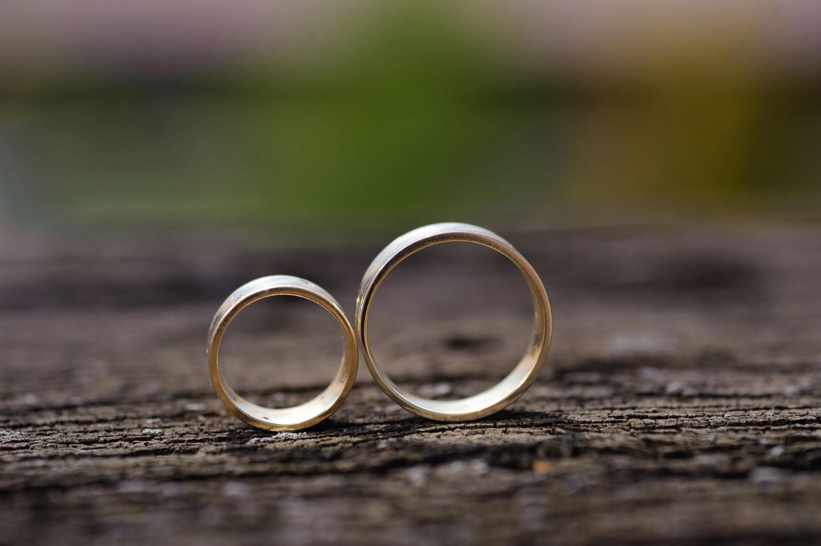 two wedding rings standing up