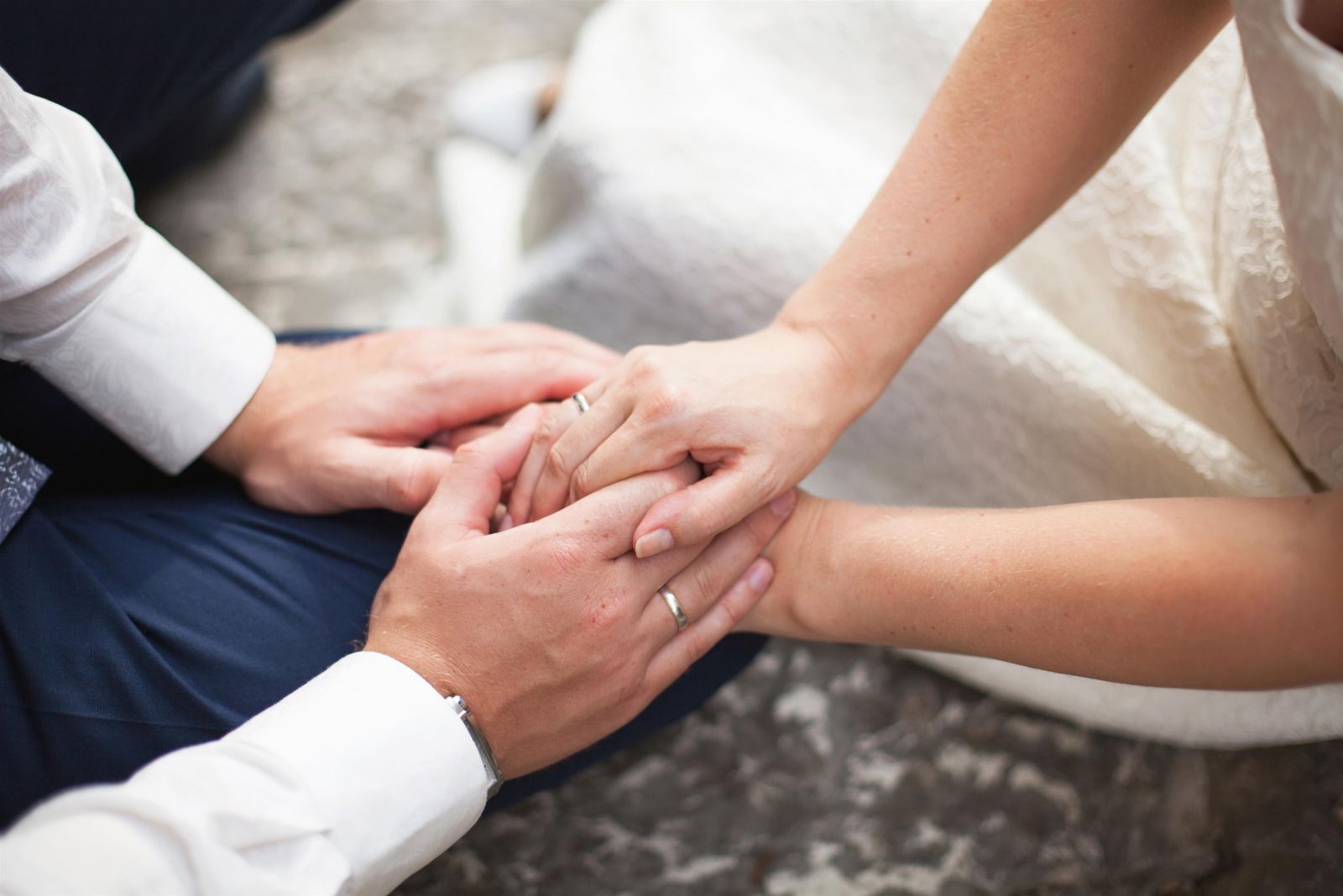 bride and groom holding hands