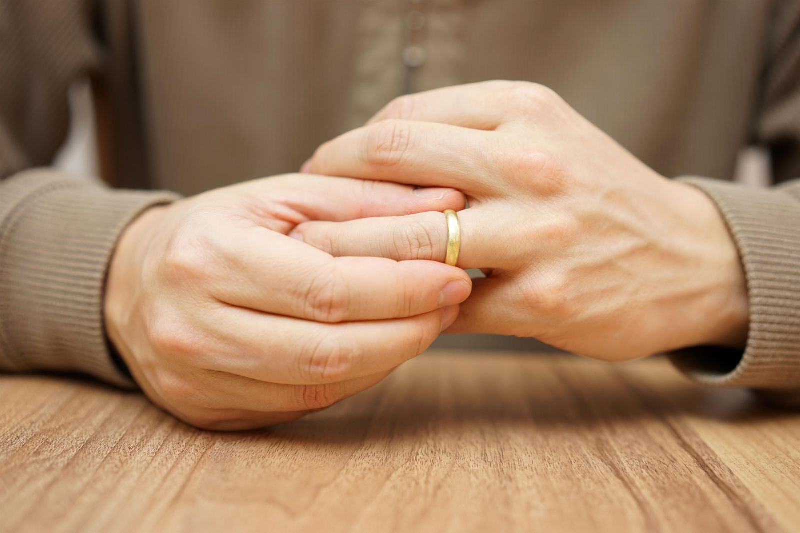 man holding wedding ring