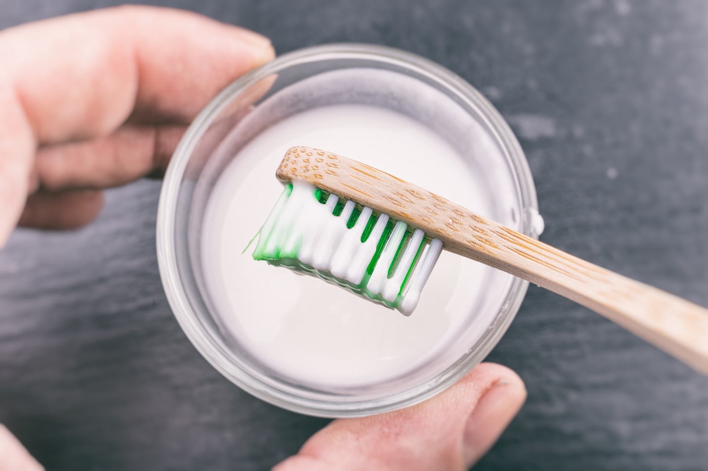 toothbrush and baking soda water 